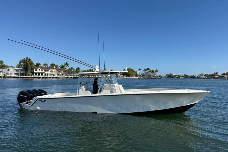  Yacht Photos Pics 2018 SeaVee 390Z boat on calm water, clear sky, coastal background.