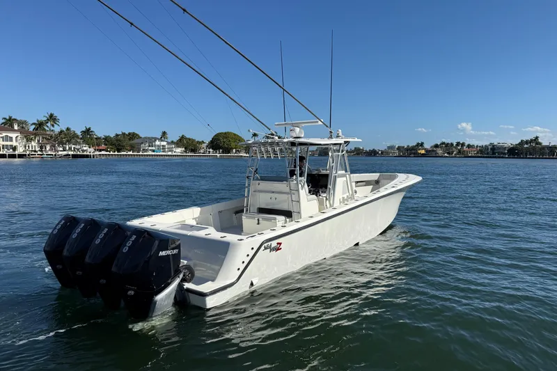  Yacht Photos Pics 2018 SeaVee 390Z boat with triple Mercury engines on calm water.