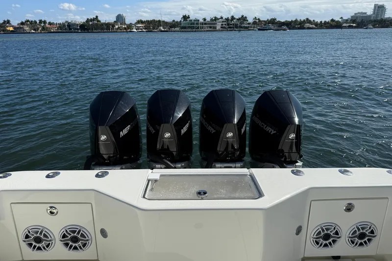  Yacht Photos Pics 2018 SeaVee 390Z boat with four Mercury outboard engines on a calm water backdrop.