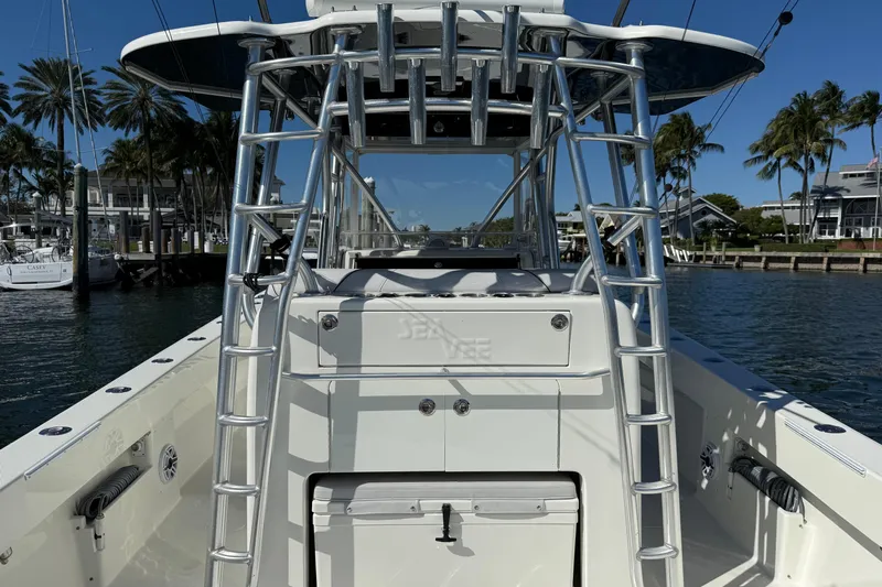  Yacht Photos Pics 2018 SeaVee 390Z boat with T-top and ladder, docked in a marina.