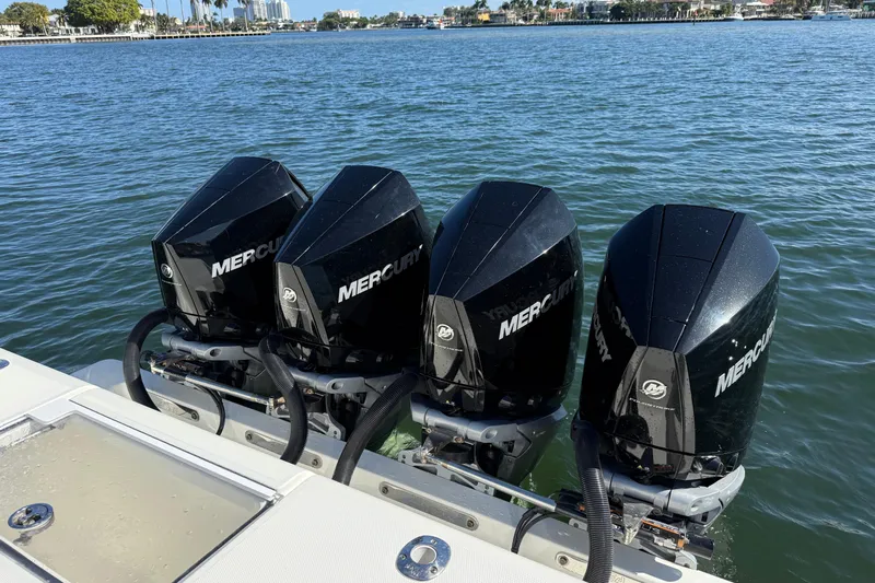  Yacht Photos Pics Four Mercury outboard engines on a 2018 SeaVee 390Z boat in calm waters.