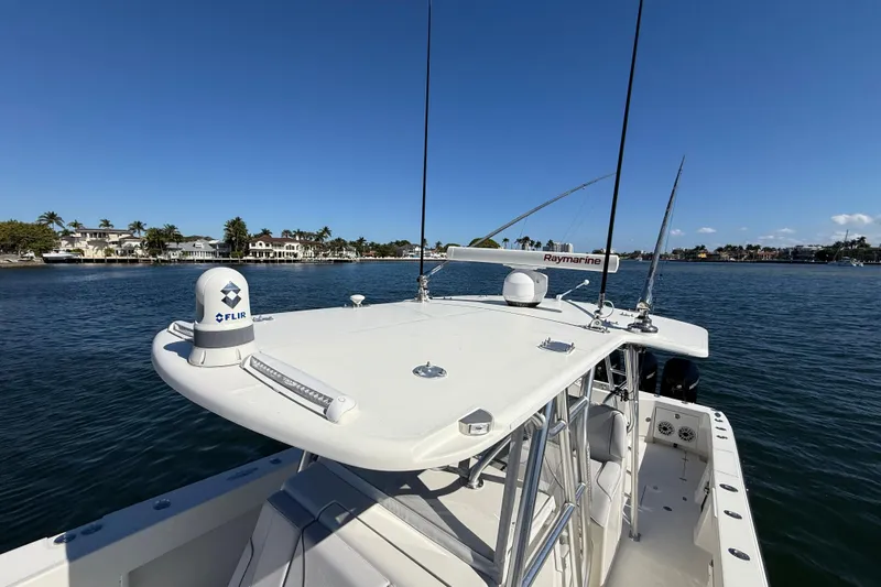  Yacht Photos Pics 2018 SeaVee 390Z boat with advanced navigation equipment on calm waters.