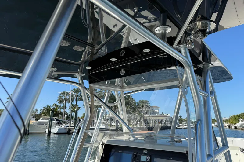  Yacht Photos Pics 2018 SeaVee 390Z boat with sleek metal framework and marina backdrop.