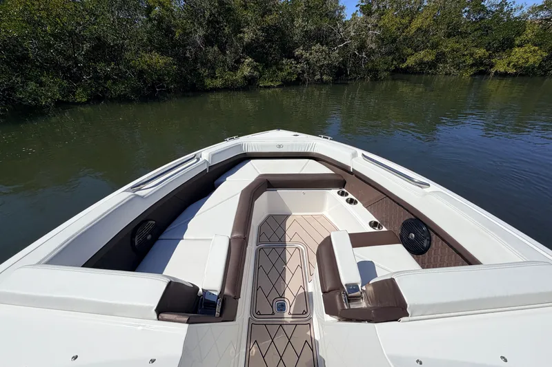  Yacht Photos Pics 2022 Cobalt R8 Outboard boat interior with luxurious seating on calm water.