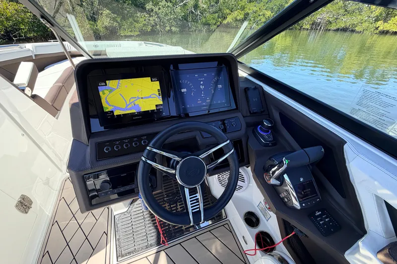  Yacht Photos Pics 2022 Cobalt R8 Outboard boat dashboard with navigation screens and steering wheel.