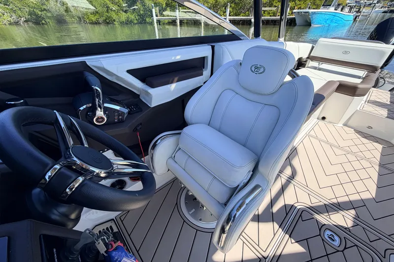  Yacht Photos Pics 2022 Cobalt R8 Outboard boat interior with luxury seating and steering wheel.