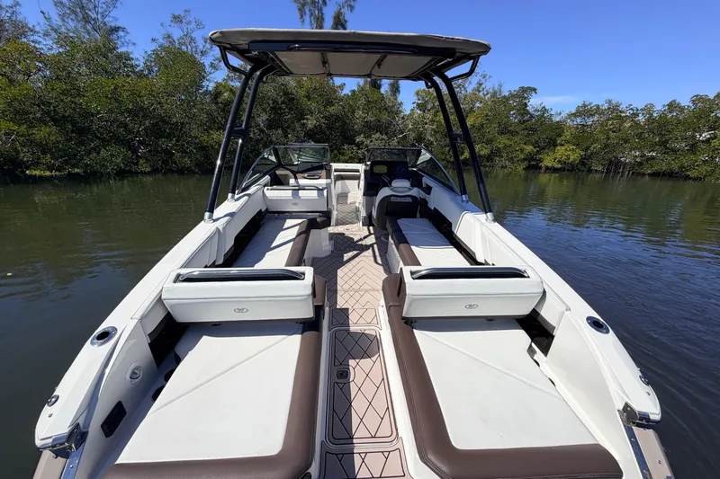 Yacht Photos Pics 2022 Cobalt R8 Outboard boat with spacious seating on a calm river.