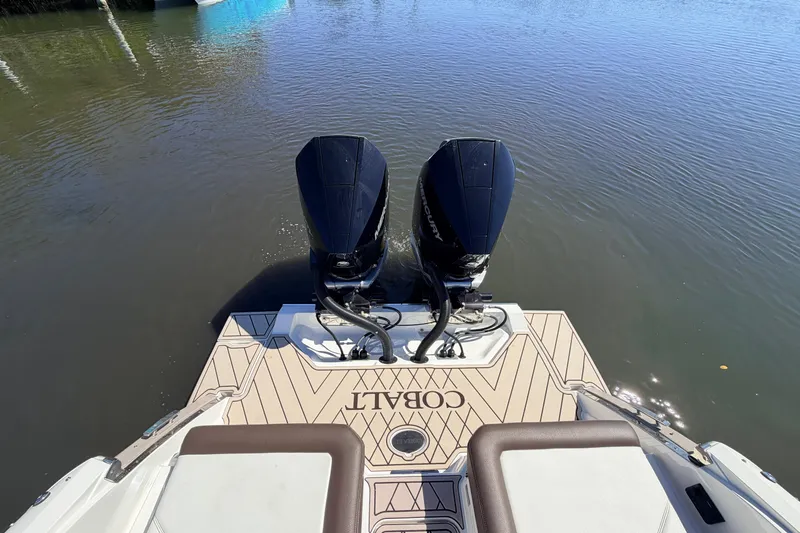  Yacht Photos Pics 2022 Cobalt R8 Outboard boat with dual engines on calm water.