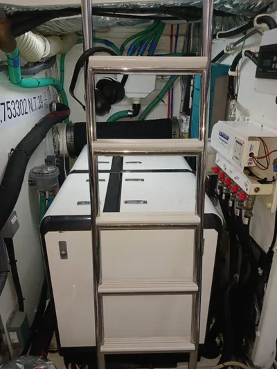 Palmar Yacht Photos Pics Engine room of 2023 Princess F55 yacht with ladder and equipment.