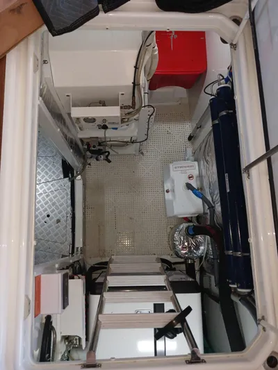 Palmar Yacht Photos Pics Engine room of 2023 Princess F55 yacht, featuring modern equipment and storage solutions.