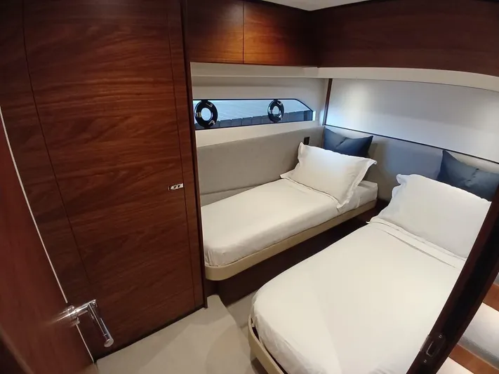 Palmar Yacht Photos Pics Luxurious twin cabin in 2023 Princess F55 yacht with elegant wood finish.