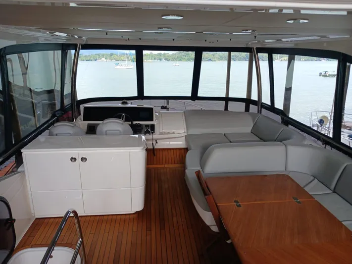 Palmar Yacht Photos Pics Interior of 2023 Princess F55 yacht with elegant seating and wooden flooring.