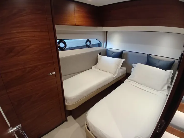 Palmar Yacht Photos Pics Luxurious twin cabin in 2023 Princess F55 yacht with modern wood finish.
