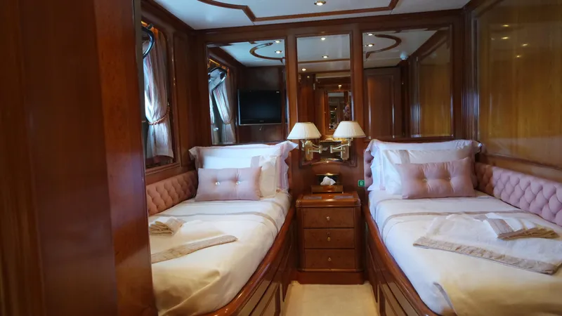 Bdt Yacht Photos Pics Luxurious twin cabin interior on 2003 Benetti Classic 115 yacht, featuring elegant wood finishes.