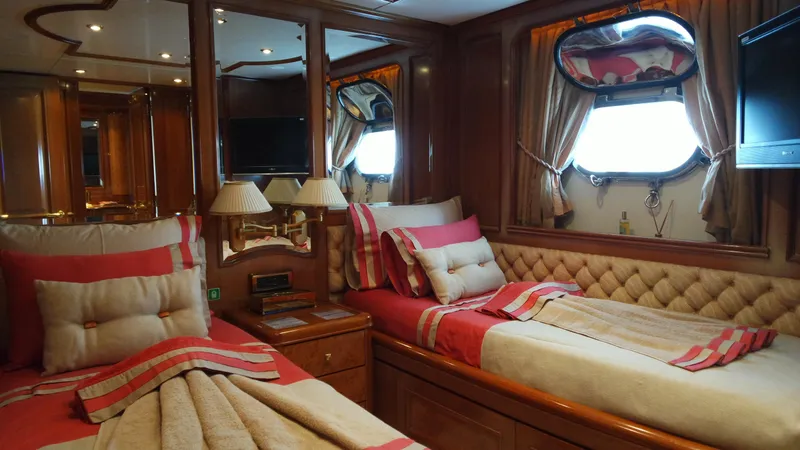 Bdt Yacht Photos Pics Luxurious cabin interior of 2003 Benetti Classic 115 yacht with elegant bedding and wood finishes.