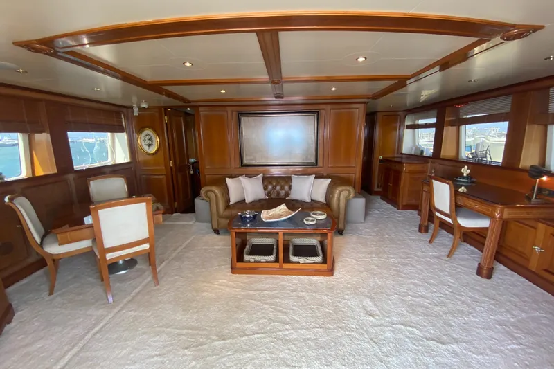 Bdt Yacht Photos Pics Luxurious interior of 2003 Benetti Classic 115 yacht with elegant wood paneling and plush seating.
