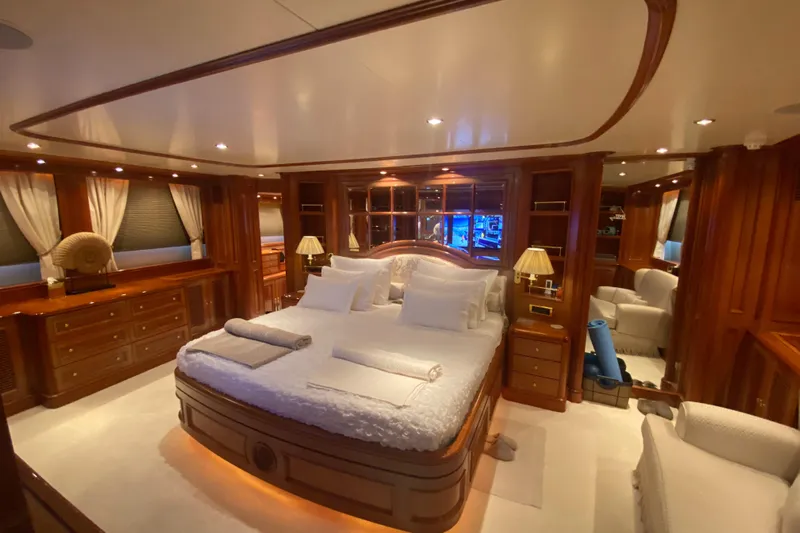 Bdt Yacht Photos Pics Luxurious bedroom interior of 2003 Benetti Classic 115 yacht with elegant wood finishes.