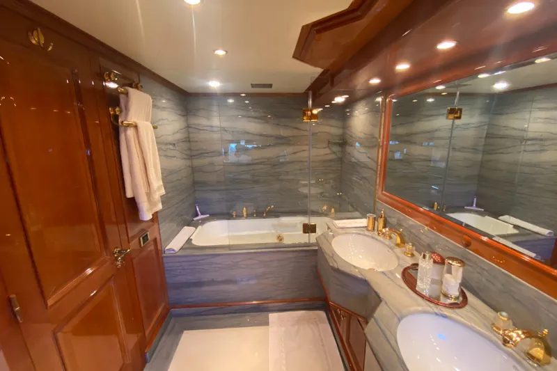 Bdt Yacht Photos Pics Luxurious bathroom on 2003 Benetti Classic 115 yacht with marble and gold accents.