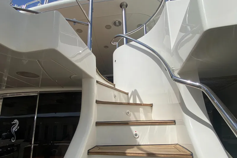 Bdt Yacht Photos Pics Staircase on a 2003 Benetti Classic 115 yacht, featuring sleek design and polished railings.