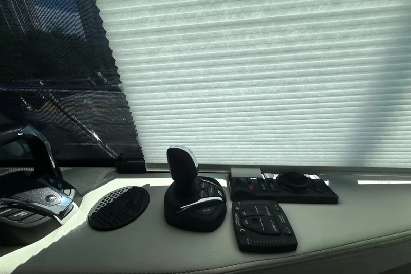  Yacht Photos Pics Control panel of 2023 Regal 38 FXO boat with joystick and buttons.