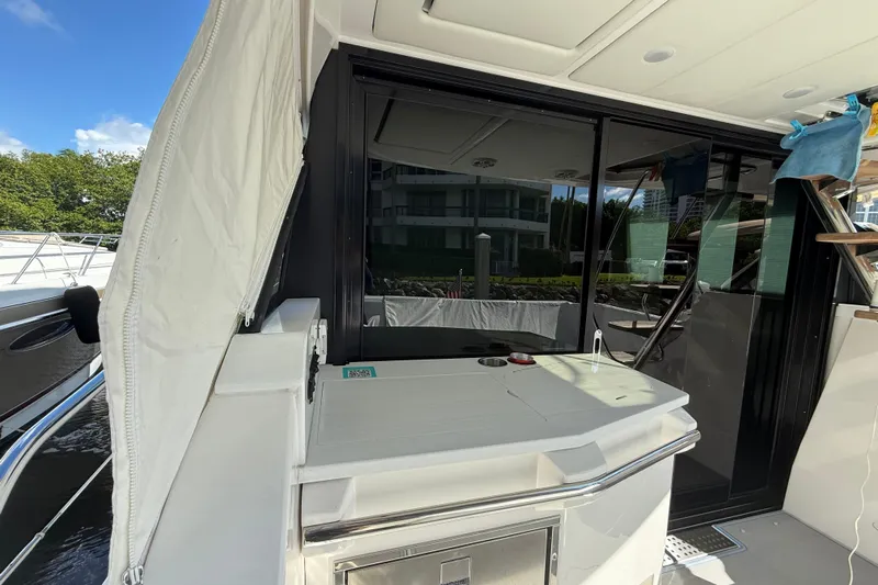  Yacht Photos Pics 2023 Regal 38 FXO yacht deck with sleek design and modern amenities.