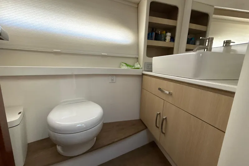  Yacht Photos Pics Bathroom interior of 2023 Regal 38 FXO yacht with modern fixtures and cabinetry.