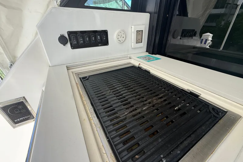  Yacht Photos Pics 2023 Regal 38 FXO yacht grill and control panel setup.