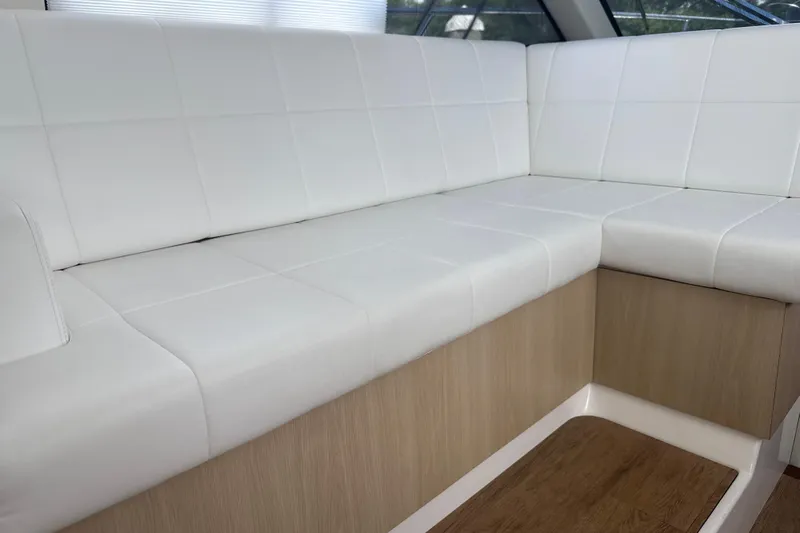  Yacht Photos Pics Luxurious white seating on 2023 Regal 38 FXO boat interior.