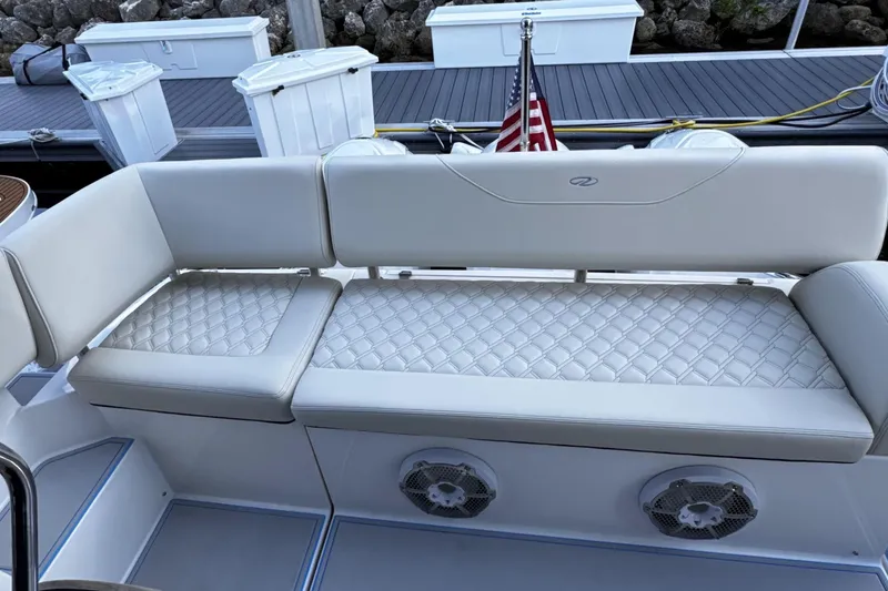  Yacht Photos Pics Luxurious seating on 2023 Regal 38 FXO boat with quilted upholstery and speakers.