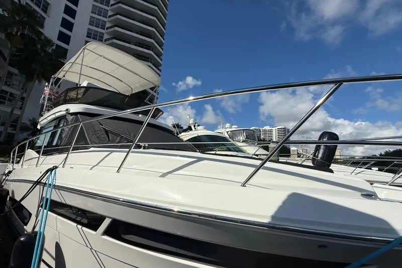  Yacht Photos Pics 2023 Regal 38 FXO yacht docked under clear blue sky.