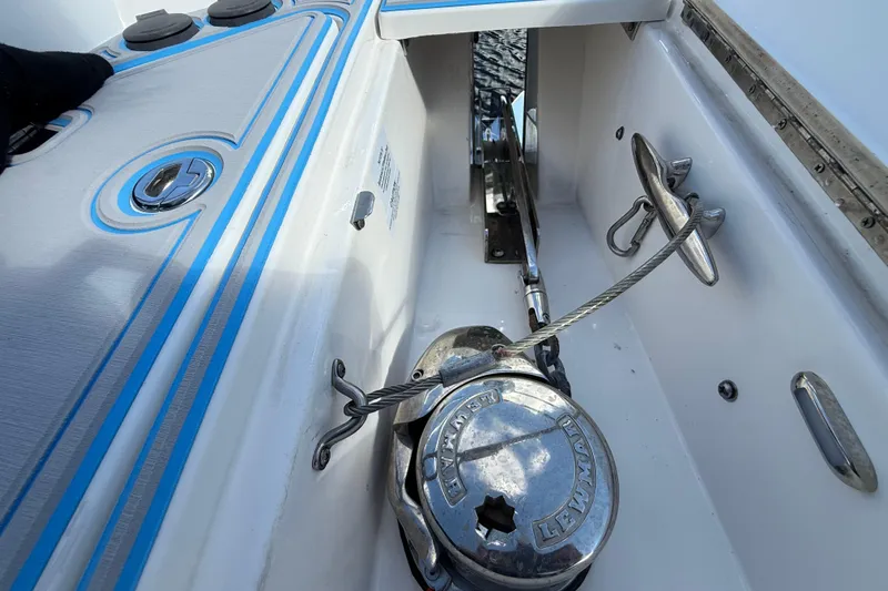  Yacht Photos Pics 2023 Regal 38 FXO boat anchor system with blue accents and chrome fittings.