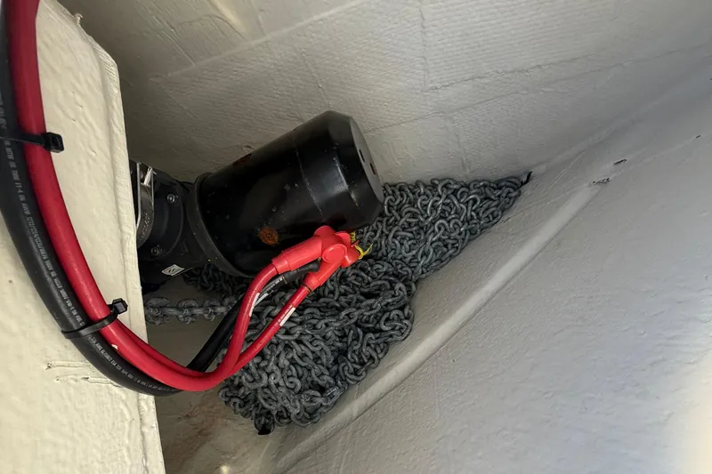  Yacht Photos Pics 2023 Regal 38 FXO boat interior with anchor chain and electrical wiring.