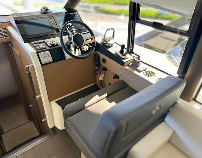 420 Fly Yacht Photos Pics 2024 Prestige 420 Flybridge helm with modern controls and comfortable seating.