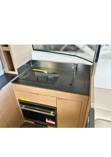 420 Fly Yacht Photos Pics Modern kitchen area in 2024 Prestige 420 Fly yacht with sleek design.