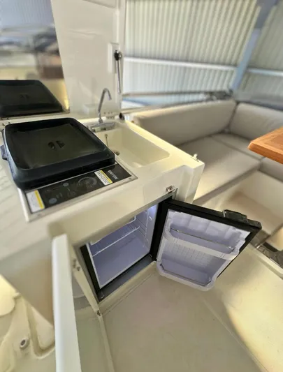 420 Fly Yacht Photos Pics 2024 Prestige 420 Fly yacht interior with kitchenette and seating area.