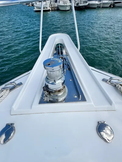  Yacht Photos Pics 2011 Hatteras GT60 yacht bow with anchor winch, docked in marina.