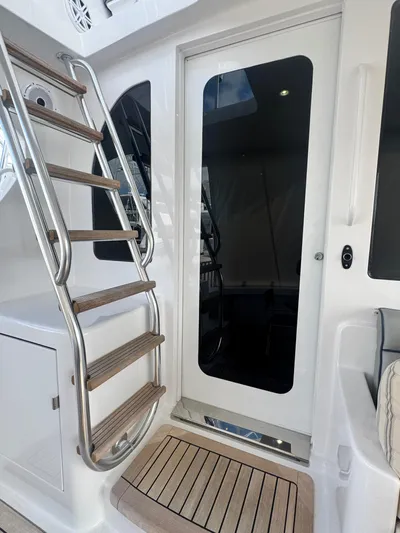  Yacht Photos Pics 2011 Hatteras GT60 yacht with sleek stairs and modern glass door.