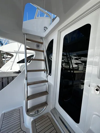  Yacht Photos Pics 2011 Hatteras GT60 yacht with sleek ladder and modern design elements.