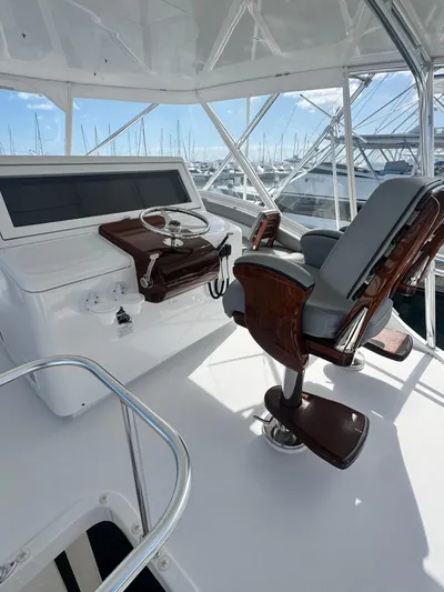  Yacht Photos Pics 2011 Hatteras GT60 yacht helm with luxurious seating and modern controls.