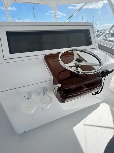  Yacht Photos Pics 2011 Hatteras GT60 helm station with steering wheel and controls.