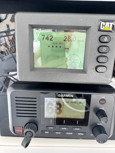  Yacht Photos Pics Hatteras GT60 2011 boat dashboard with CAT and Garmin displays.