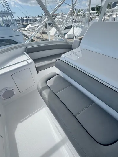  Yacht Photos Pics Interior view of 2011 Hatteras GT60 yacht with sleek seating and marina backdrop.