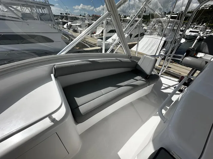  Yacht Photos Pics 2011 Hatteras GT60 yacht interior with sleek seating, docked at marina.