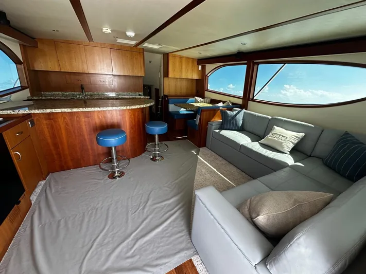  Yacht Photos Pics Luxurious interior of 2011 Hatteras GT60 yacht with modern seating and ocean view.