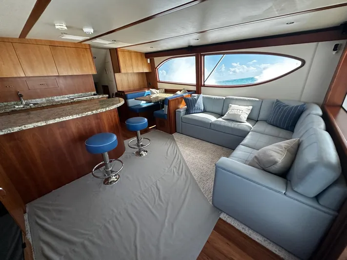  Yacht Photos Pics Luxurious 2011 Hatteras GT60 yacht interior with modern kitchen, seating, and ocean view.