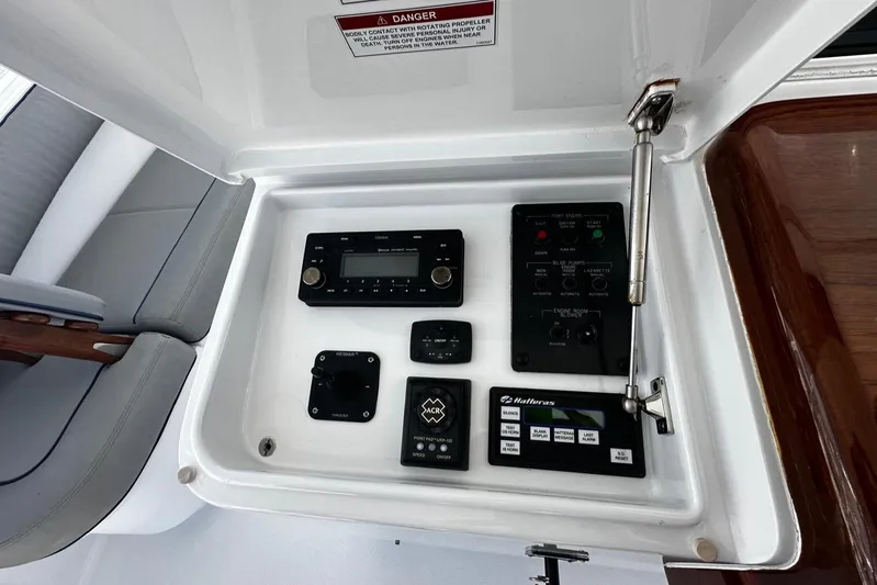  Yacht Photos Pics Control panel of a 2011 Hatteras GT60 yacht, featuring various electronic instruments.