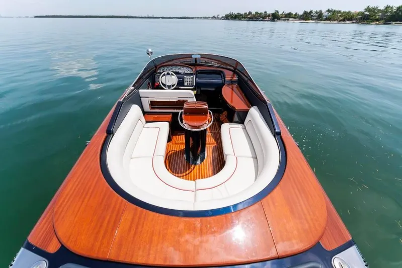 Our Trade Yacht Photos Pics 2020 Riva Aquariva Super luxury boat with elegant wooden deck and white seating.