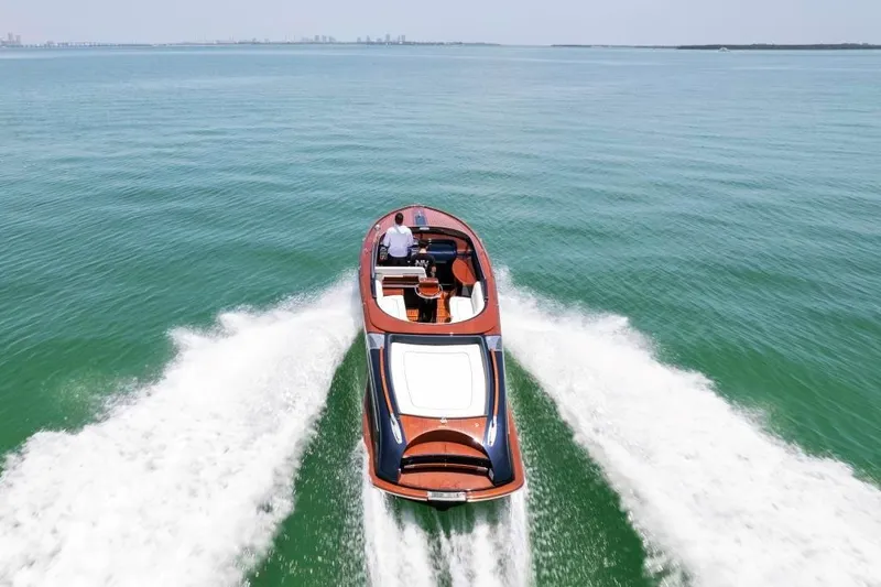 Our Trade Yacht Photos Pics Riva Aquariva Super 2020 luxury speedboat cruising on open water.