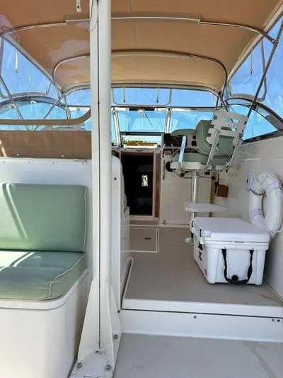  Yacht Photos Pics 1999 Sabreline 36 Express boat interior with seating and helm station.