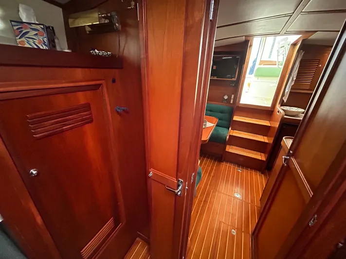  Yacht Photos Pics Interior of 1999 Sabreline 36 Express yacht with wooden finishes and seating area.